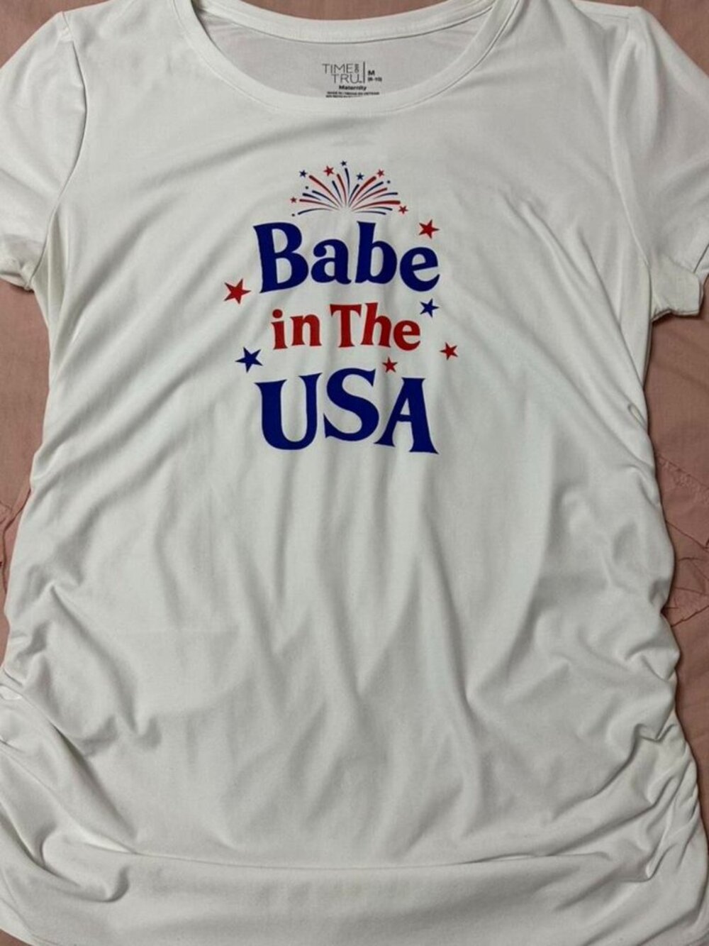 White patriotic maternity graphic top with side ruching.